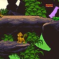 Lion King game gameplay scene with jungle environment and lion characters.