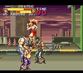 Street Fighter II gameplay screenshot with characters fighting on a city rooftop.
