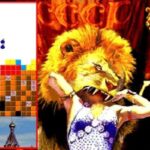 Lion and tiger themed puzzle game with a girl celebrating victory.