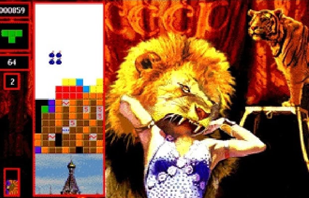 Lion and tiger themed puzzle game with a girl celebrating victory.