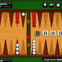 Red and white checkers game on a wooden backgammon board.