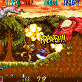 Classic arcade game Dyna Gear with a dragon and a hero in a forest setting.