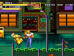Intense street fight scene from Street Fighter II with characters in combat on city street.