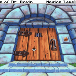 Game image of Castle Dr Brain with a wooden door and flamingo statues.