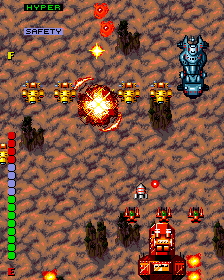 Intense arcade shooter game with spaceship battling enemies and explosions.
