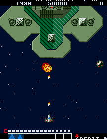 Classic Galaga arcade game screenshot with spaceship shooting enemies in space.