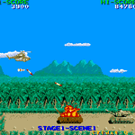 Retro arcade game screenshot with airplane, missiles, and landscape.