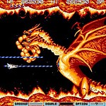 Retro arcade game featuring a dragon breathing fire at enemies.