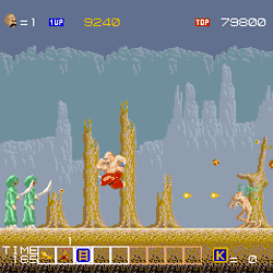 Classic arcade game scene with characters and enemies in a forest setting.