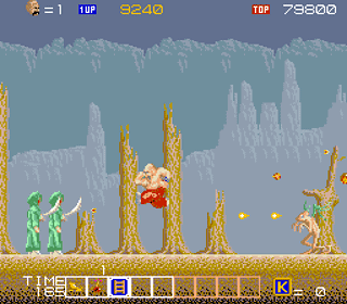 Classic arcade game scene with characters and enemies in a forest setting.