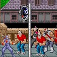 Street of Rage 2 gameplay scene with characters fighting on the sidewalk.
