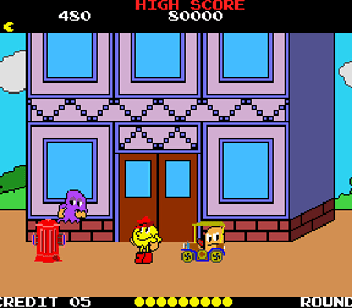 Adventure World game scene with colorful characters and building background.