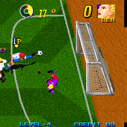 Soccer video game scene with players and goalpost in pixel art style.