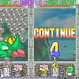 Classic bubble shooter game featuring a green dragon and bubble popping mechanics.