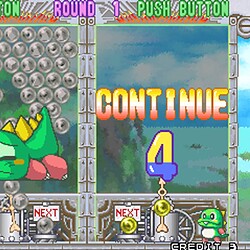Classic bubble shooter game featuring a green dragon and bubble popping mechanics.