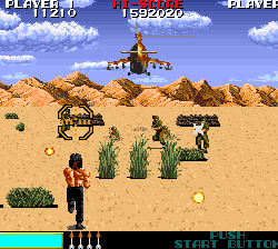 Classic desert combat arcade game with soldiers, helicopter, and explosions.