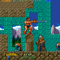 Ancient Warrior platformer game featuring a muscular hero battling enemies on icy mountain terrain.
