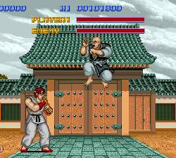 Fighting game screenshot featuring two martial artists battling in front of a traditional Asian temp.