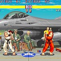 Fighting game scene featuring Ryu and Ken in front of a fighter jet aircraft.