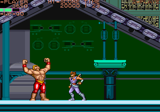 Iconic Street Fighter II character Ryu in a fighting stance against a muscular opponent.
