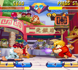 Ryu and Ken battle in Street Fighter II arcade game scene, showcasing classic fighting action.