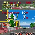 Vintage racing game screenshot showing a car dashboard and track view.