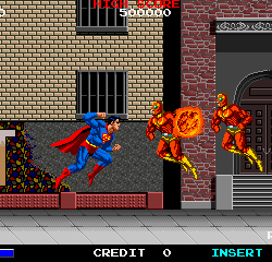 Classic arcade game featuring Super Mario battling fire-throwing enemies in a city setting.