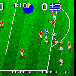 Retro soccer game with players and goal on a green field.