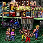 Streets of Rage 2 arcade game scene with fighters on city street.