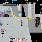 Classic arcade game Ghosts 'n Goblins gameplay with enemies and hero in action.