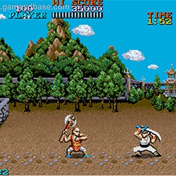 Retro arcade game scene with martial artists fighting in a traditional setting.