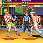 Arcade fighting game scene with two fighters in a boxing ring at night.