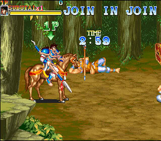 Retro arcade game screenshot featuring warriors fighting in a forest setting.