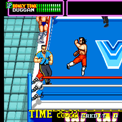 Classic wrestling game screenshot with fighters in ring and referee.