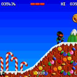 Classic Christmas-themed game scene with candy canes and gingerbread house.