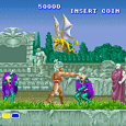 Colorful pixel art scene from a fantasy-themed arcade game with characters and dragons.