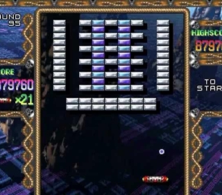 Classic arcade game screenshot with brick-breaking action.