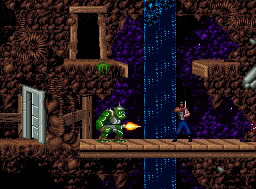 A pixelated scene of a green T-Rex battling a man with a gun in a forest cave environment.