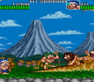 Classic arcade game with cavemen and dinosaurs in a prehistoric landscape.