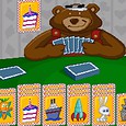 Cute teddy bear playing card game with colorful illustrated cards on a green table.