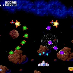Classic arcade space shooter game with colorful aliens and asteroid battles.