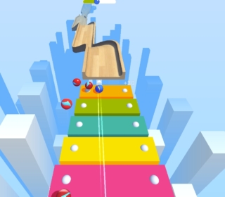 Color Race game scene with rolling balls on a vibrant rainbow path, navigating through a colorful 3D environment.