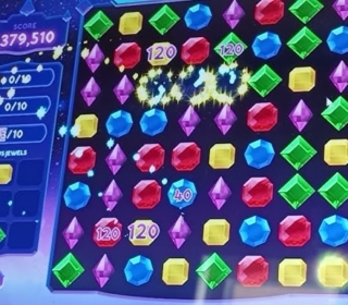 Colorful gem puzzle game on Minigames.pro, vibrant match-3 gameplay with high scores.