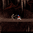 Skeleton fighting a man on a bridge in a dark cave.