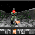 Screenshot of Doom with pixelated graphics and a monster enemy.